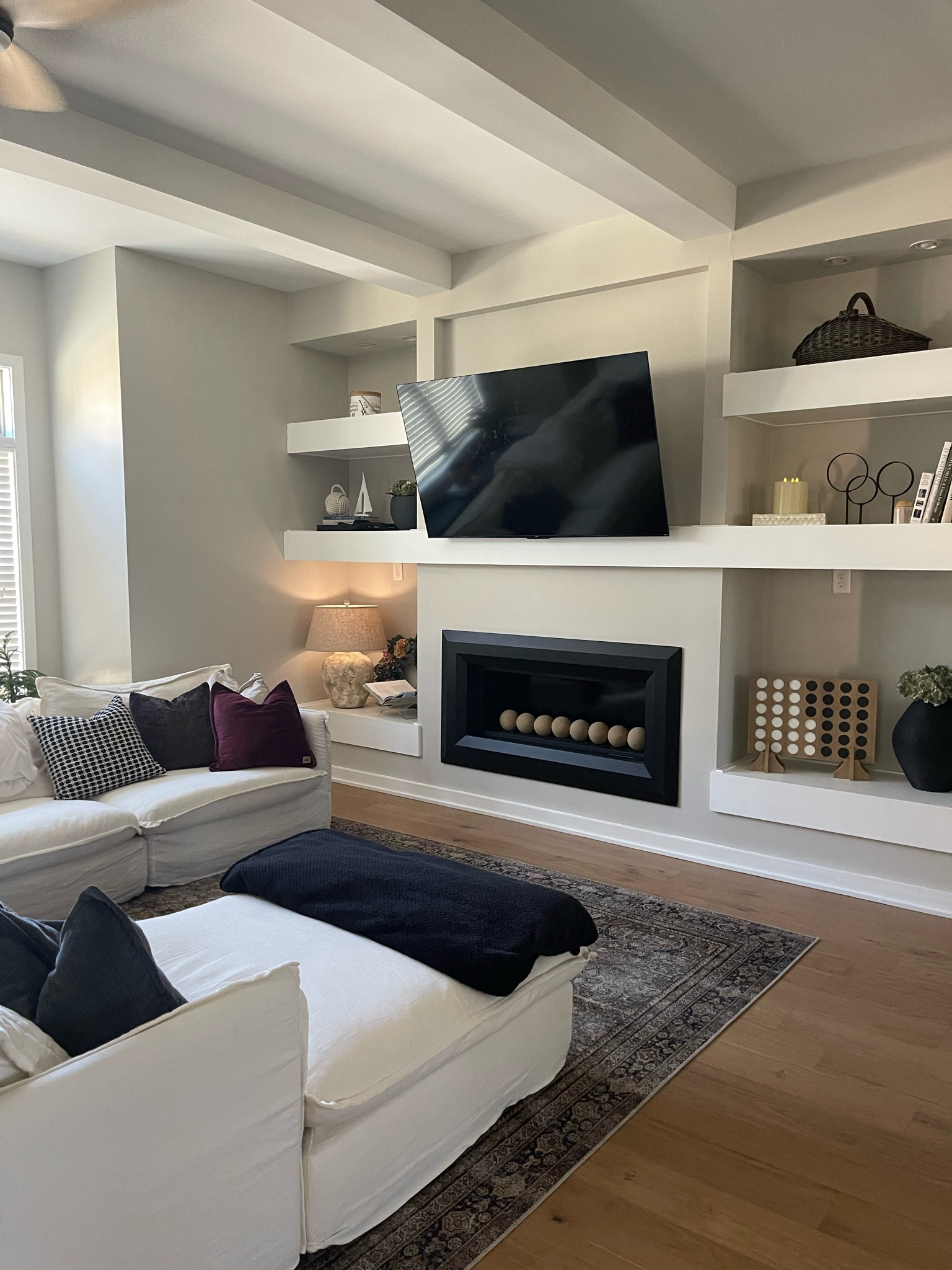 Living room! Love these built ins. Sectional is from Sixpenny the Neva sectional in water lily. I’m unable to link it on here, I did link similar couches on wayfair and amazon with great reviews! 

Home decor, fireplace, hydrangeas, vase, couch, blanket throw, pillows, rug, basket, lamp, lighting, tv, tech, coffee table books 

Rug, 

#LTKFindsUnder100 #LTKSaleAlert #LTKHome