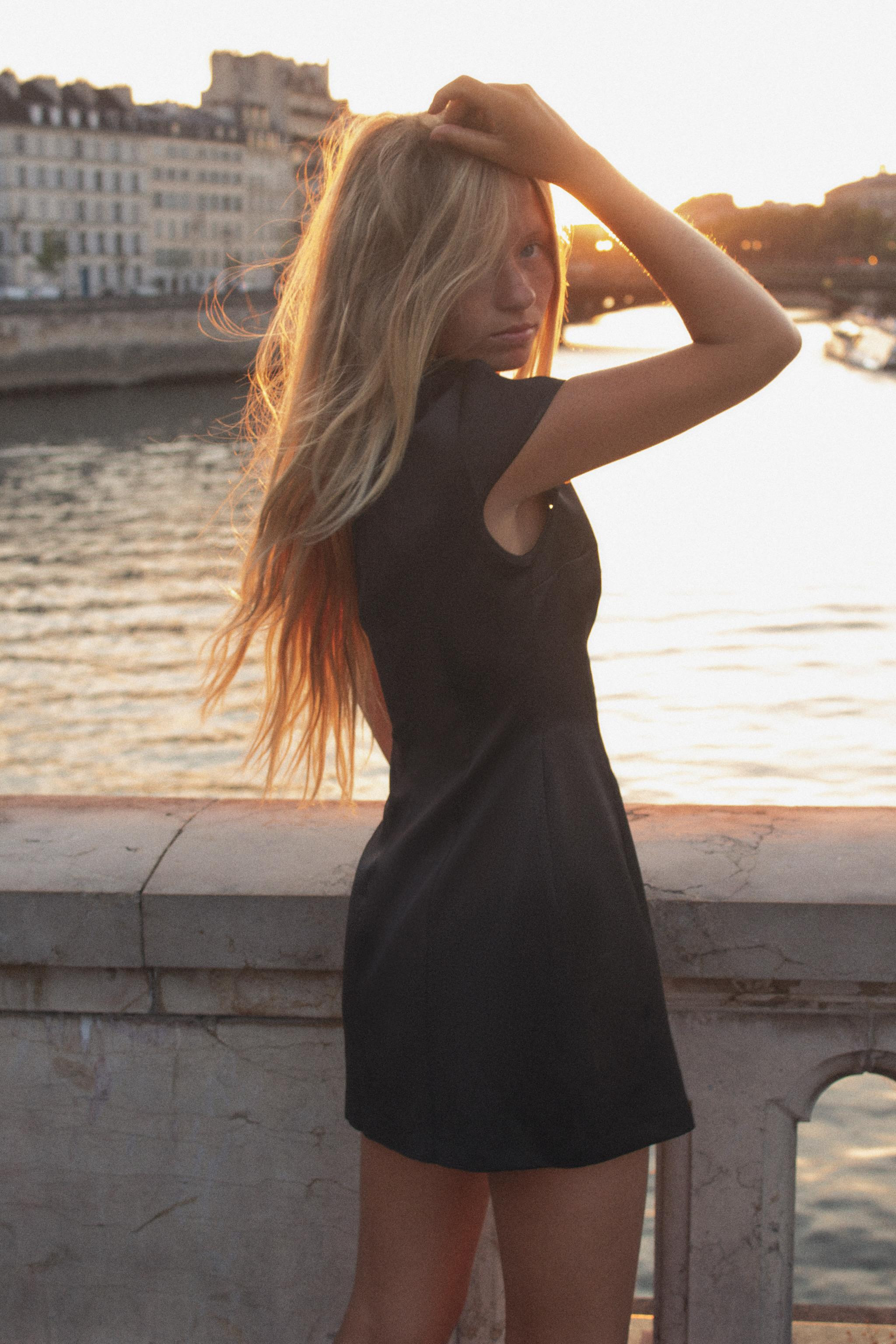 Mini dress with a high neck featuring a slit and button detail. Short sleeves. Matching lining. I... | Zara UK