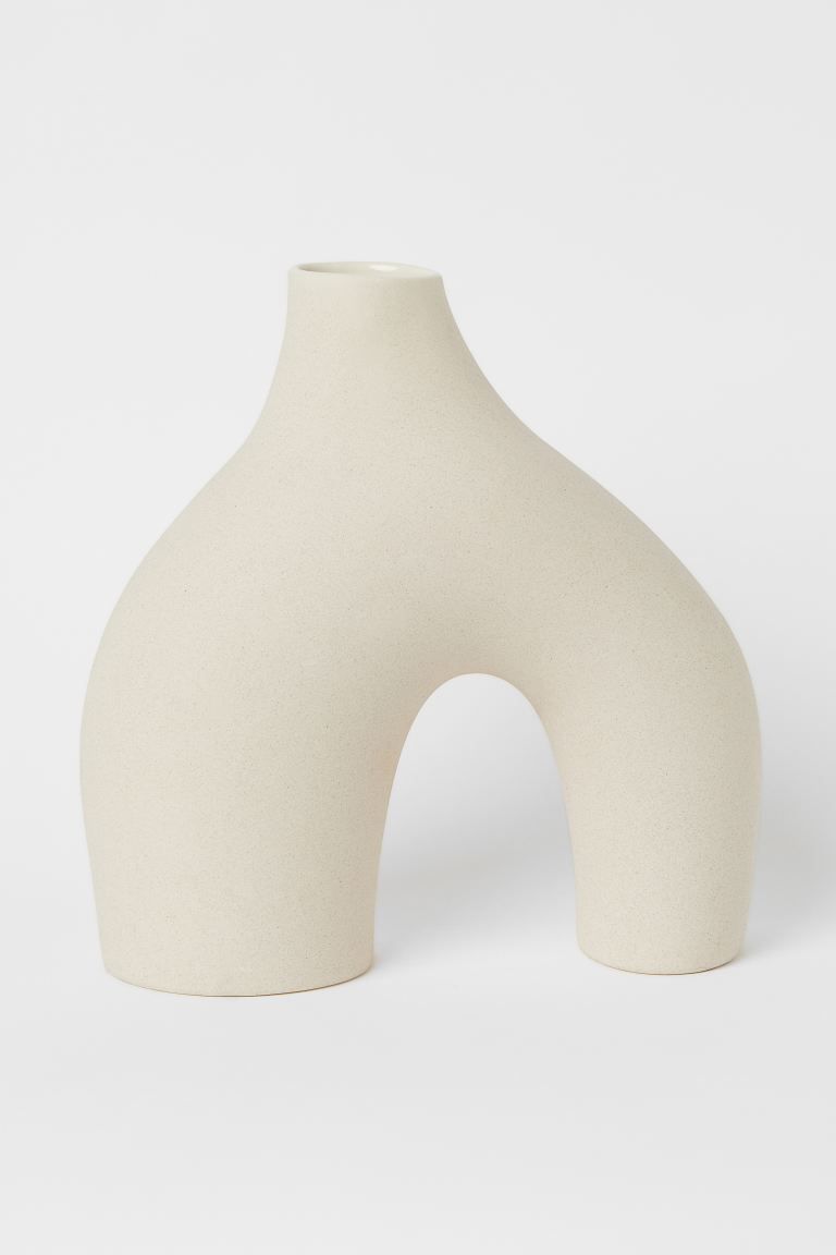 Tall vase in glazed stoneware with a soft, irregular shape and two legs with different widths. De... | H&M (US + CA)
