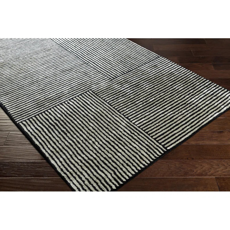 Balos Hand Tufted Black/Ivory Rug | Wayfair North America