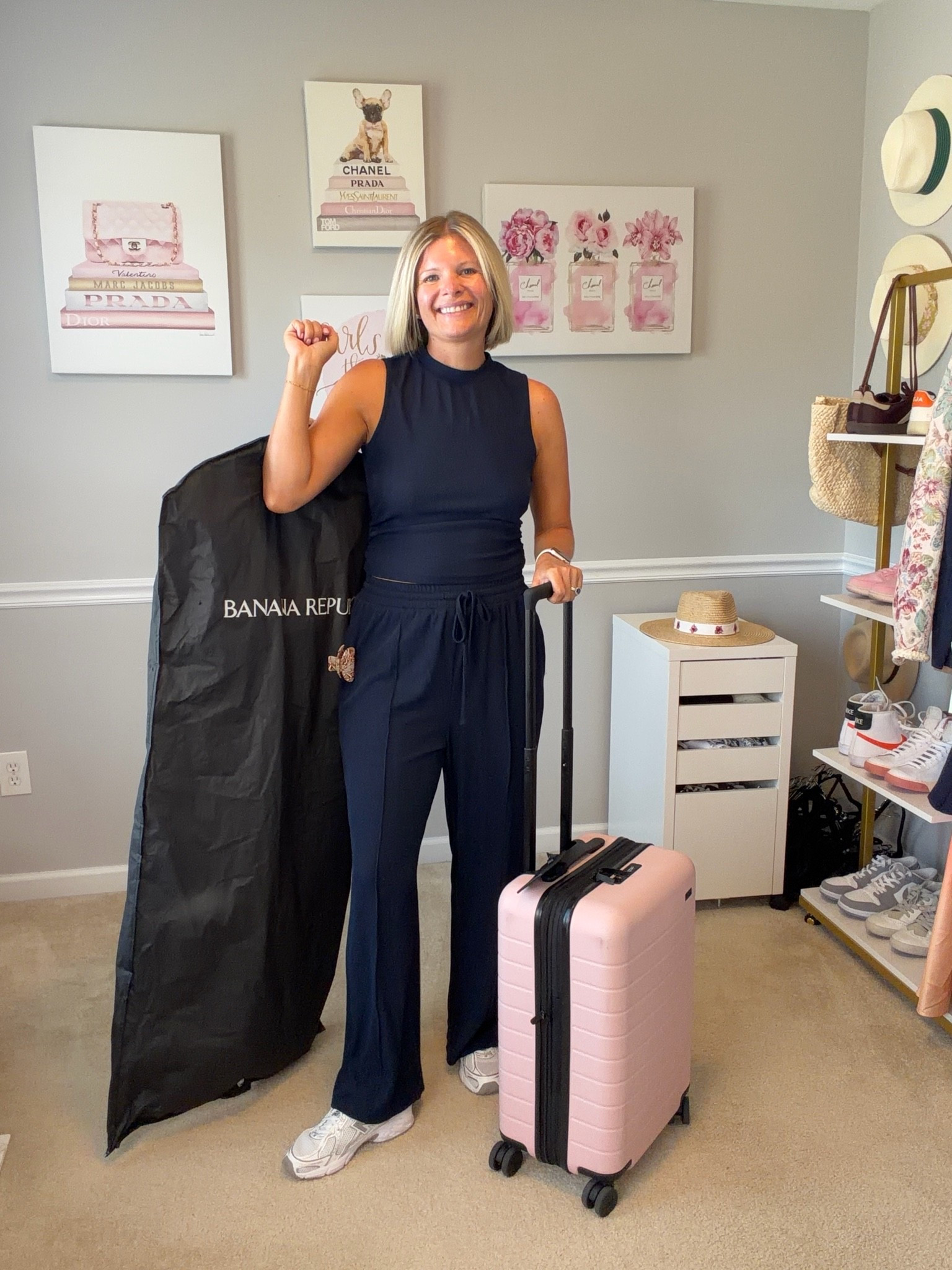 Navy two piece pants and top travel setvTTs
Pink carry on luggage

#LTKTravel #LTKOver40