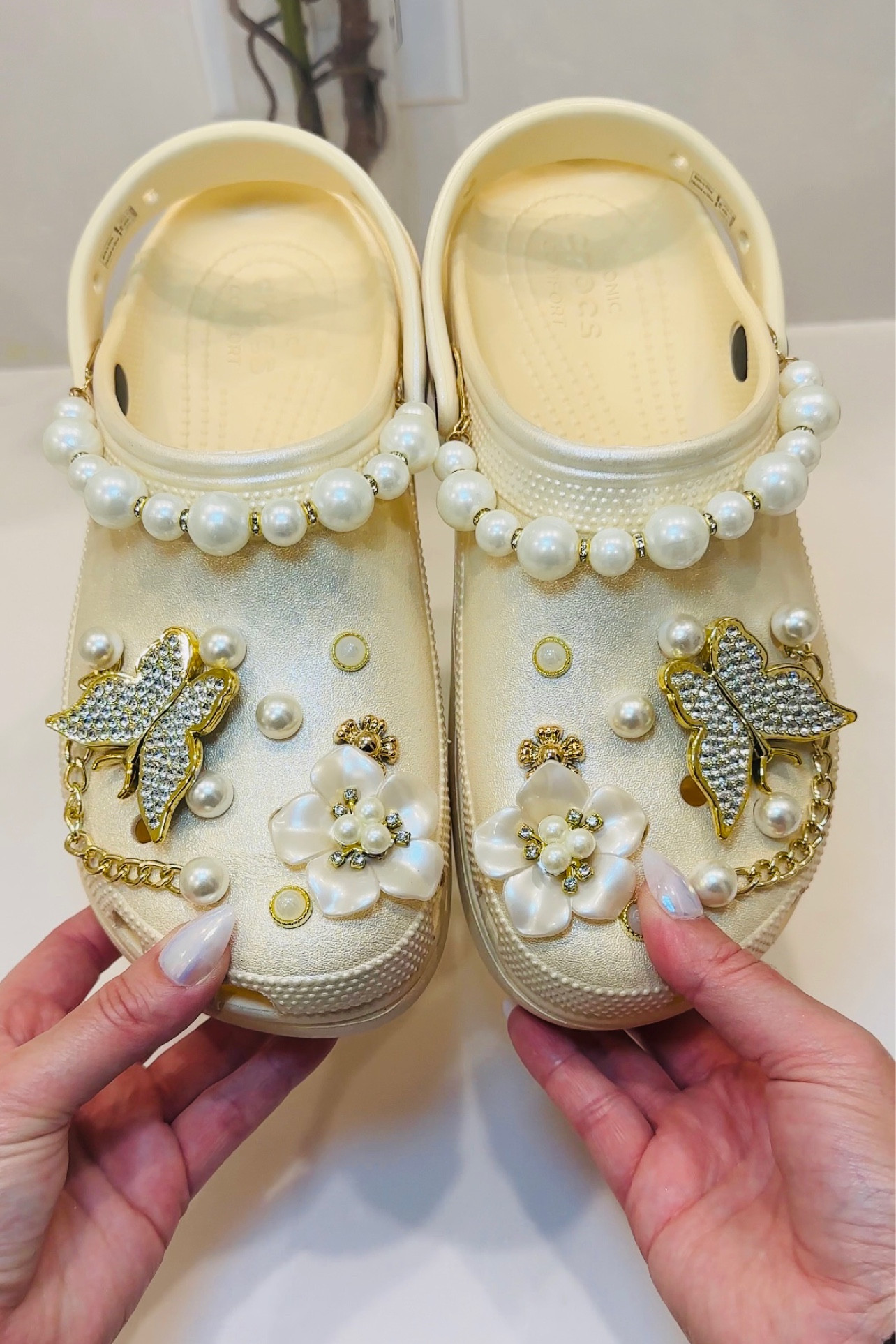 Step up your mom game with these high heel Croc with fancy’s charms. 💃✨ Because every fabulous mom deserves comfort and style in one chic package. #MomLife #FashionForward #HighHeelCrocs”