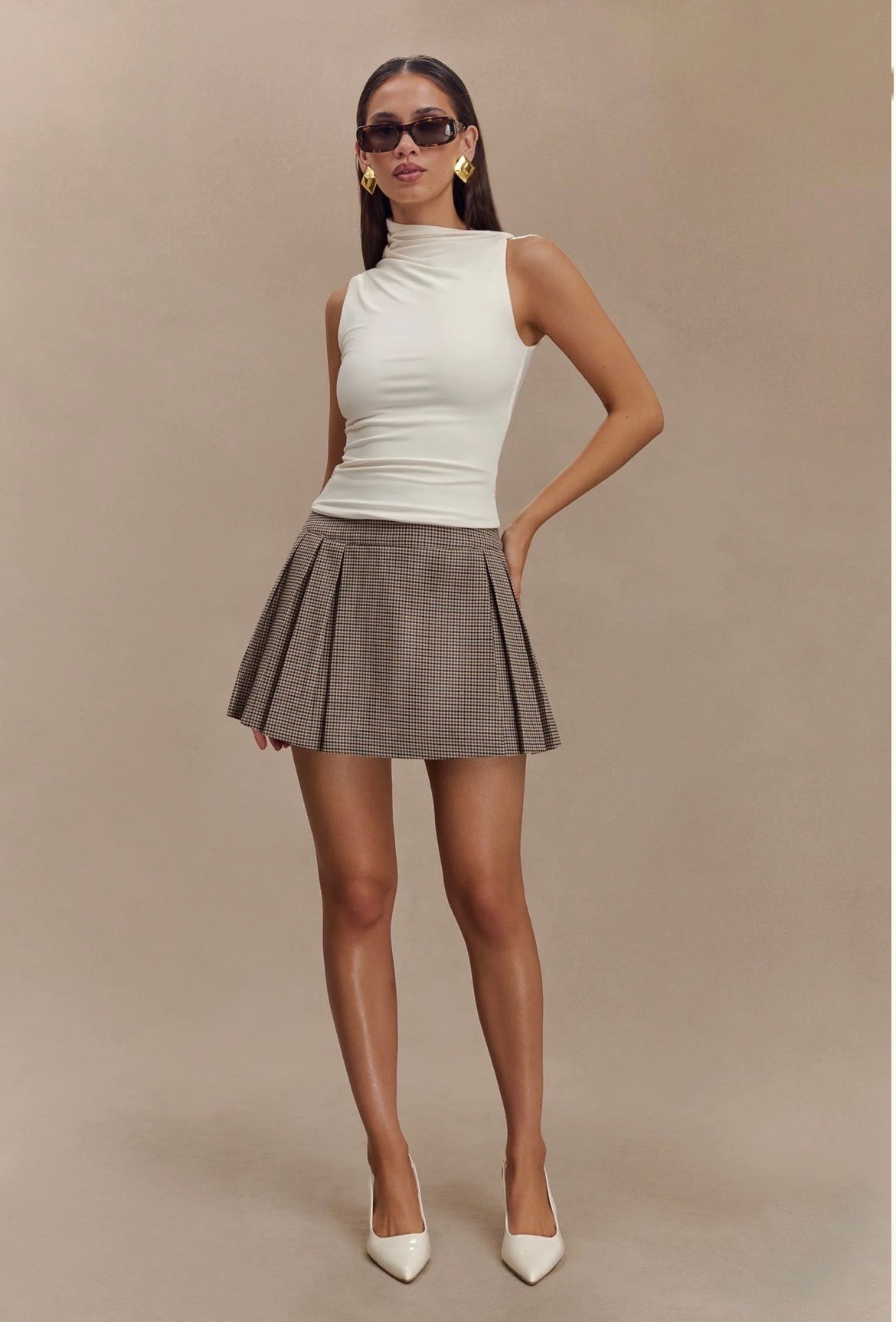 Casual Outfits

Hadleigh
Sleeveless Slinky Top - Ivory

Angie
Pleated Buckle Mini Skirt - Tan Check