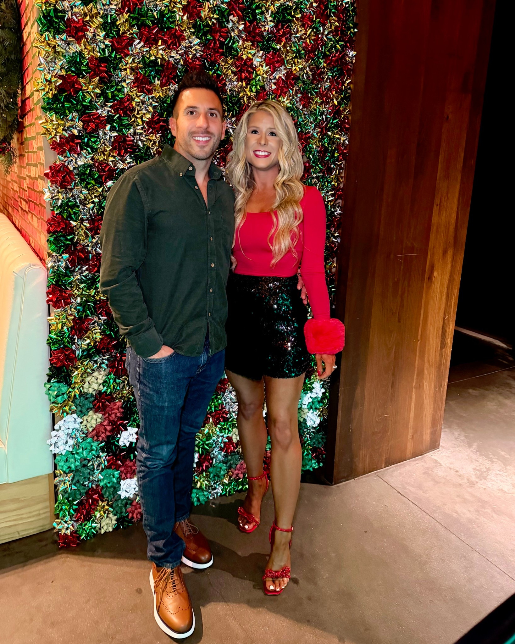 Holiday party outfit styled with a red long sleeve top, faux fur cuffs, black sequin miniskirt, sparkly red bow heels, and a matching red satin bow clutch! I added these faux fur cuffs to the red top for a fun, festive holiday outfit! They can be added to any holiday top and come in a variety of colors!

Christmas outfit, Christmas party outfit, sequin skirt, sparkly skirt, holiday skirt, red heels, holiday heels, sparkly heels

#LTKSaleAlert #LTKHoliday #LTKootd