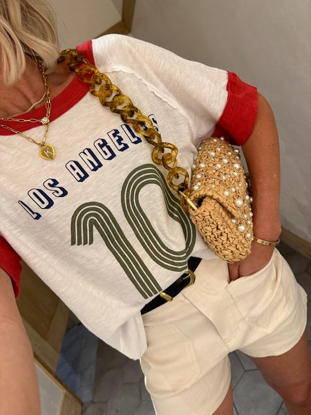 Graphic tee in my true size xs
Shorts run small. I’m a 24 or 25 in denim and I liked the 25 in these
Pearl and straw clutch is so cute
Summer outfit 

#LTKfindsunder100 #LTKstyletip #LTKover40