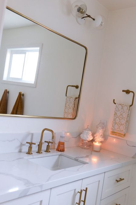 What Accent Colors Look Best with a White and Gold Modern Small Bathroom Remodel?

When it comes to remodeling a small modern bathroom, there are many design options to choose from. One popular option is to utilize white and gold in the design to create a bright and sophisticated look that helps create a space that feels larger than it actually is. However if white and gold are a little more boring than you had in mind and you want to add color here are a few options you can choose from. To create a more dynamic and inviting space, neutral tones like grey, cream, and beige can be used to add warmth and texture to the room. Dark colors like navy blue, dark green, and black can be used to create a luxurious and modern look. Additionally, bold colors like bright yellow, electric blue and orange can be used as accent colors to add a pop of personality to the space. For more of a calming effect, soft pastel colors like pink, lavender, and mint green can be added to the room. Adding color doesn't have to be in the form of cabinets or wallpaper, but can also be achieved by adding small features. Think about adding a small hint of color to your backsplash or with fun accessories on your countertops. By combining colors in different ways, you can create a truly unique and stylish space that you'll proudly love to show off.



#LTKhome #LTKstyletip #LTKunder100