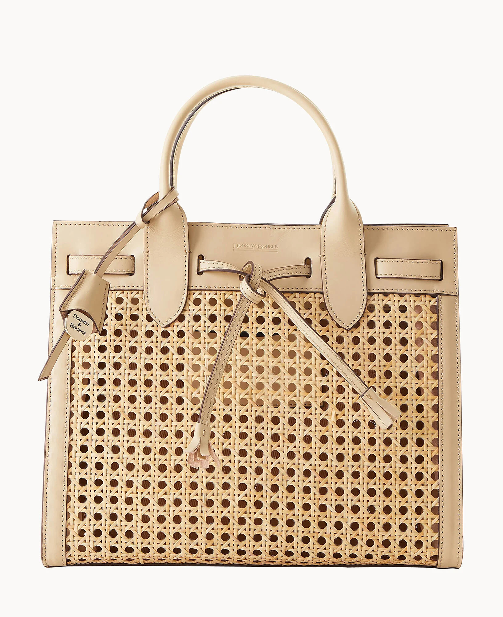 Uniquely Yours
A structured silhouette meets easygoing summer chic in this showstopping look. | Dooney & Bourke (US)