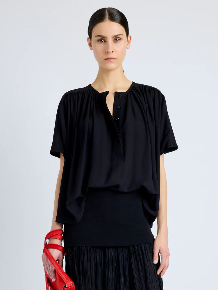 The Claire Top in Viscose Georgette is crafted to an airy short-sleeve silhouette with a conceale... | Proenza Schouler LLC