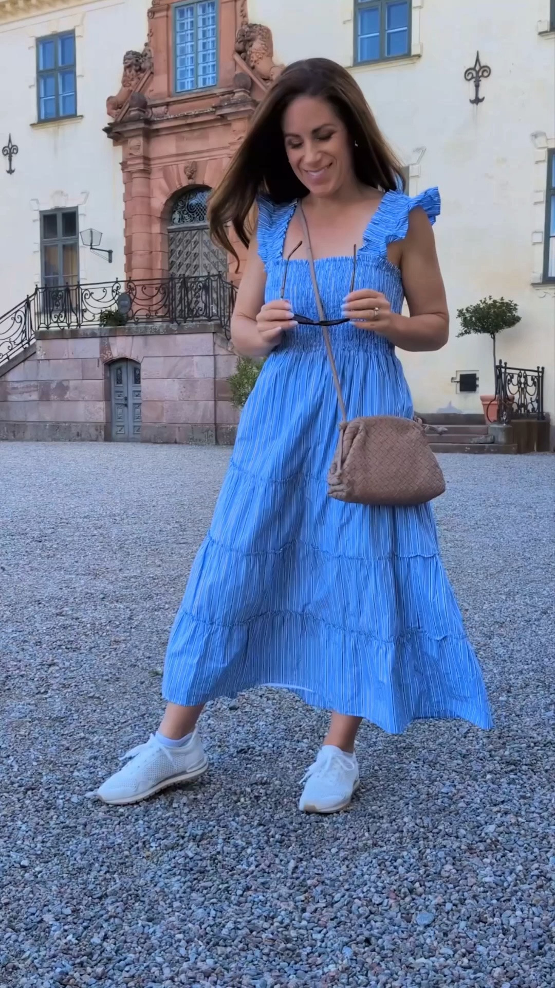 QUINCE DRESSES FOR PETITES 💙 At 4’11”, I’m always looking for summer dresses that work on a petite frame — especially easy travel dresses I can wear with comfortable flats or sneakers.

This Quince 100% Organic Cotton Poplin Smocked Midi Dress came with me to Stockholm and is one of those rare regular-size midi dresses that works beautifully on my petite frame. I love the defined smocked bodice, lightweight cotton poplin and easy tiered silhouette for sightseeing and summer travel.

I’m also linking more of my favorite petite and petite-friendly Quince dresses here if you’re looking for vacation outfits, summer dresses or travel dresses for a shorter frame.

Wearing XS at 4’11”. ✈️💙

#petitestyle #quince #summerdress #traveldress #petitefashion