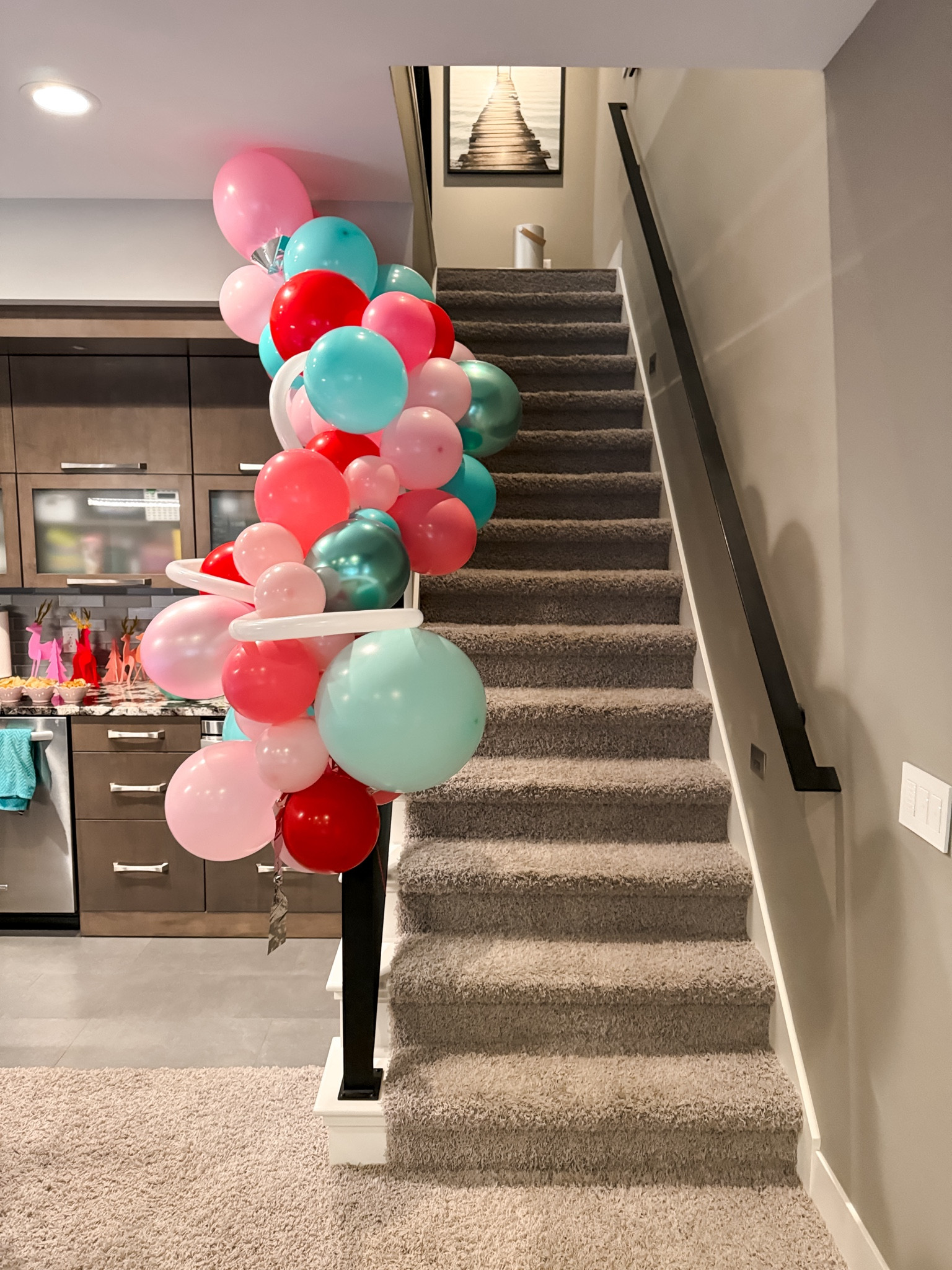 Balloon garland for holiday parties Christmas party decor ideas 