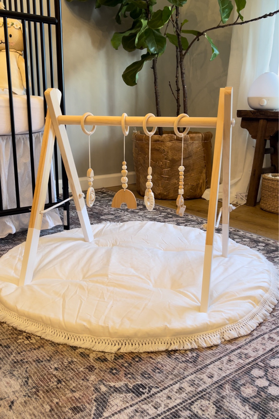 Neutral nursery. Amazon finds. Baby wooden play gym and fringe baby play mat from Amazon. Inexpensive baby finds  

#LTKbaby #LTKunder50 #LTKkids