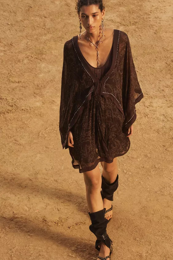 Short V-neck dress with cape sleeves. Metallic trim detail and open back. Front button closure. | Zara US