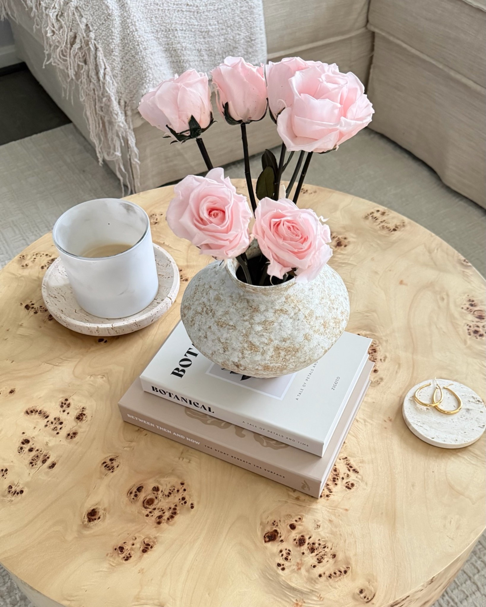 coffee table styling that’s pretty and functional. These faux forever roses are an Etsy find (color: blush) and they look so much better once you pull off all the leaves and fluff the petals out a little. In this vase they have that long stem, fresh-from-the-florist look and I’m obsessed. The two storage books underneath? They hide my coasters and TV remote inside. Every piece of neutral home decor on this burl wood coffee table serves a purpose and that’s the only way I want to style a living room. Linking everything I can below.

#coffeetabledecor #coffeetablestyling #homedecorfinds #neutralhomedecor #etsyfinds #foreverroses #fauxflowers #livingroomdecor #livingroominspo #burlwood #decorativebooks #storagebooks #homestylingtips #neutralaesthetic #ltkhome #ltkfinds #cozyhome #homedecorinspo

#LTKHome #LTKdayinmylife #LTKmomlife