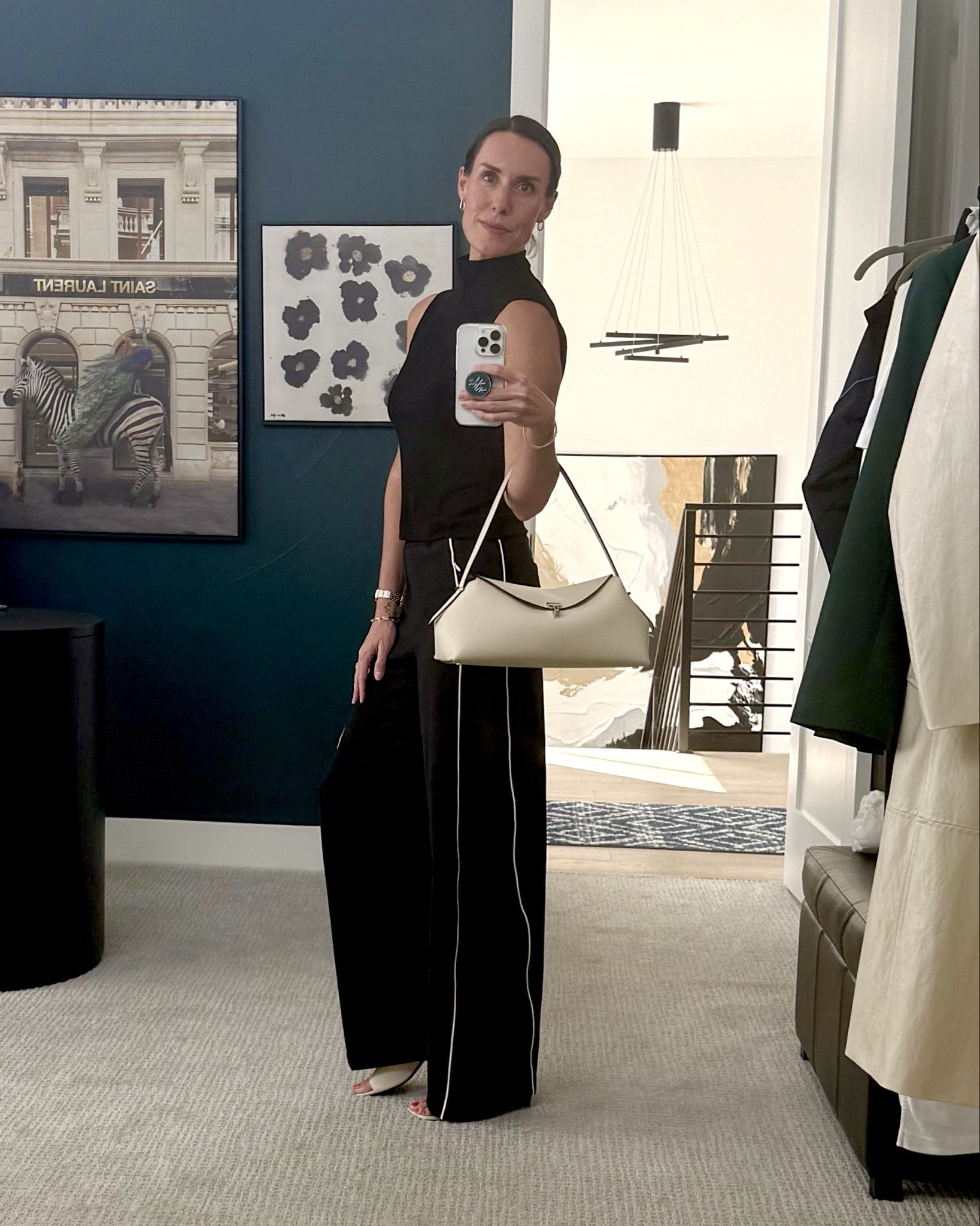 Sporty chic, elevated. Paired a track pant style with a beautiful sleeveless textured top for that monochrome look and polished off with complementing ivory or ‘milk’ colored shoes & purse and then of course the accessories. Fun, comfortable springtime look. 🖤🤍

#LTKOver40 #LTKootd
