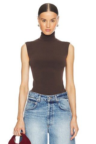 Norma Kamali Slim Fit Sleeveless Turtleneck Top in Chocolate from Revolve.com | Revolve Clothing (Global)