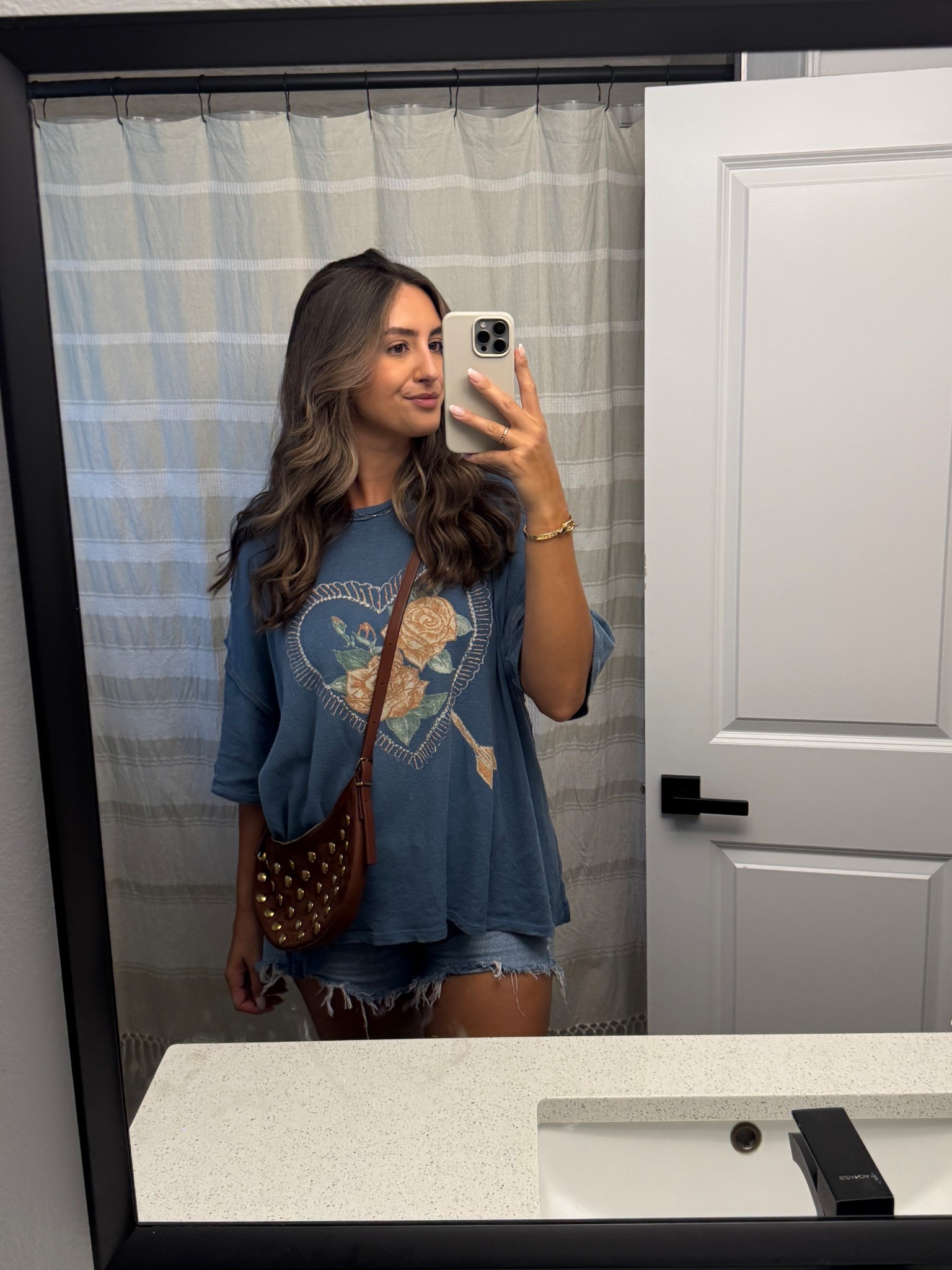 Causal denim shorts outfit with graphic tee! Loving this suede crescent bag from Madewell for going into fall! Transitions into a shoulder bag🤎🤎 

#LTKStyleTip #LTKItBag #LTKxMadewell