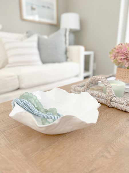Spring coffee table styling! Absolutely loving this peony bowl!
-
home decor, coastal spring decor, spring decor under $50, spring decorations, spring home decorations, coastal decor, beach house decor, beach decor, beach style, coastal home, coastal home decor, coastal decorating, coastal interiors, coastal house decor, home accessories decor, coastal accessories, beach style, blue and white home, blue and white decor, neutral home decor, neutral home, natural home decor, living room decor, coastal living room, coffee table decor, coffee table styling, coffee table accessories, coffee table tray, cane vases, coffee table, blue and white pillows, coastal pillows, woven ottoman tray, decorative bowl, white bowls

#LTKstyletip #LTKhome