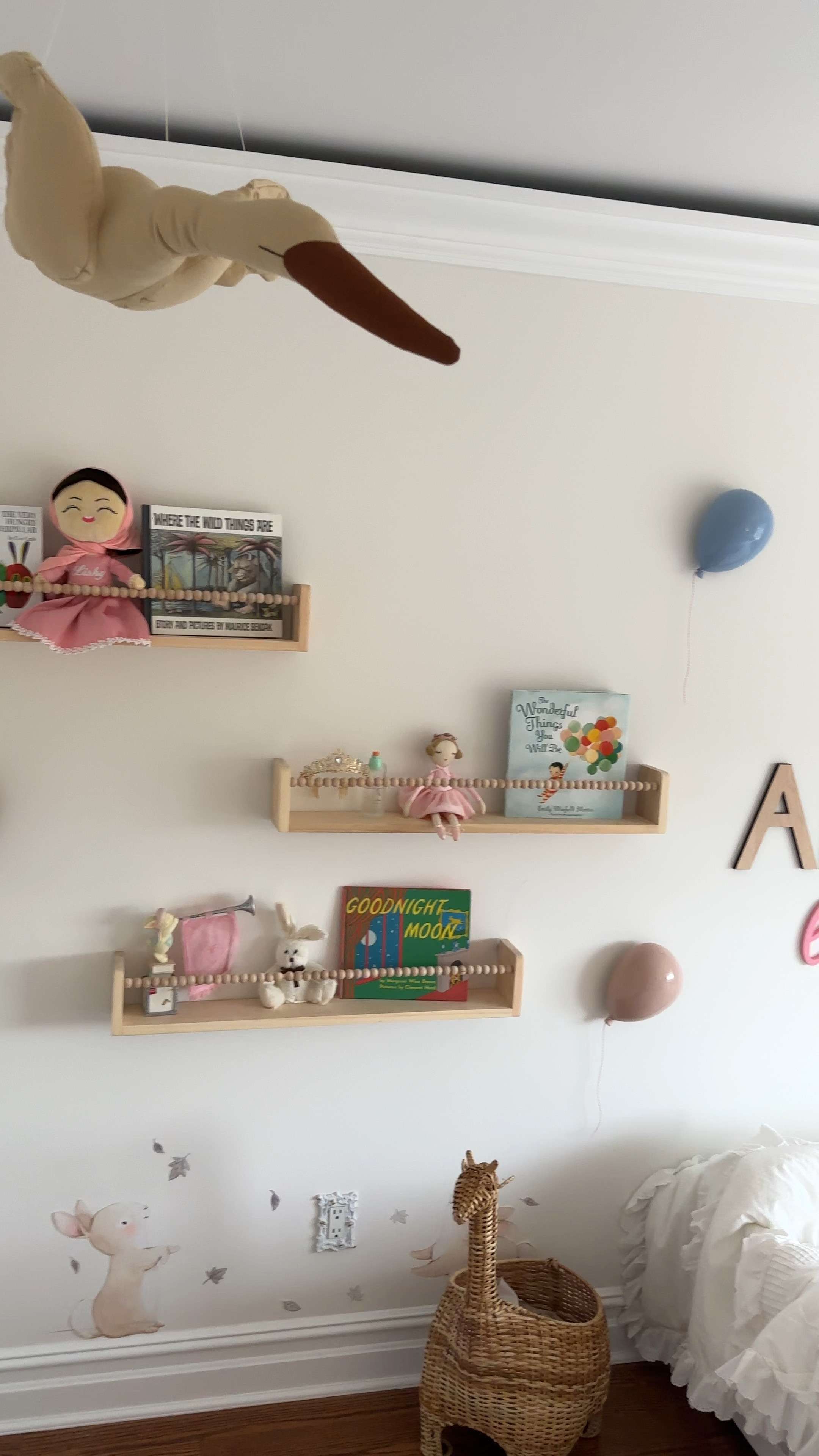 Working on an a toddler + nursery room for our girls. The theme is “Celestial Wonderland,” complete with a moon, stars, clouds, birds, hot air balloons and Visitors like bunnies, lambs and swans from the ground. Linked the bookshelves and balloons. #nursery #kidsroom #kidgirlroom #girlroom #interiordesign