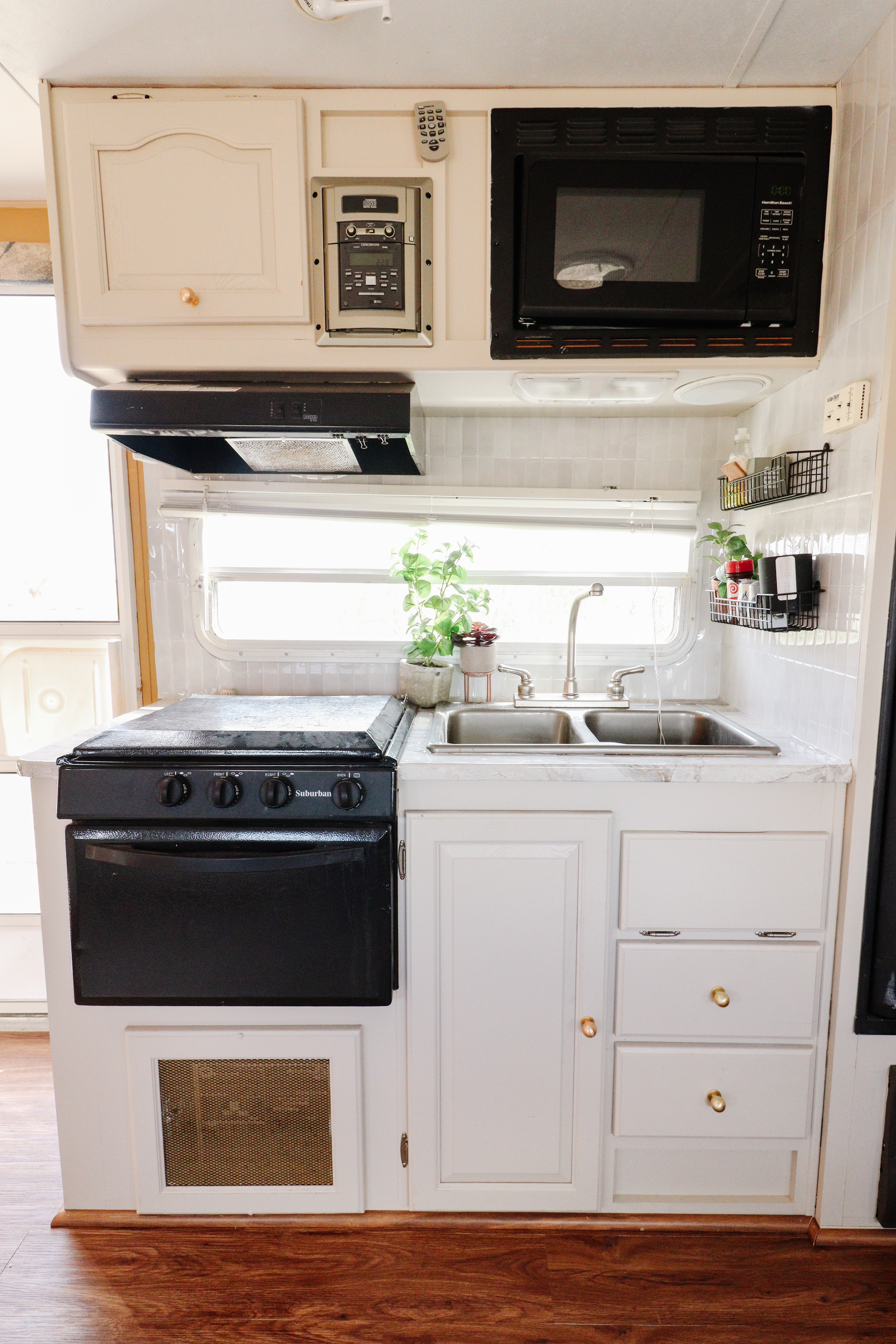 Proof that even a tiny camper kitchen can feel cute and functional! Linked everything we used to refresh this space without a full renovationl. 

 