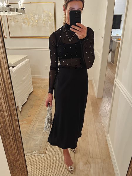 Pretty holiday outfit idea from target. Everything under $40. Rhinestone studded sheer mock neck top with a black satin skirt dressy heel and silver. Bag everything runs tts. Wearing xs in all 

#LTKfindsunder50 #LTKHoliday #LTKstyletip