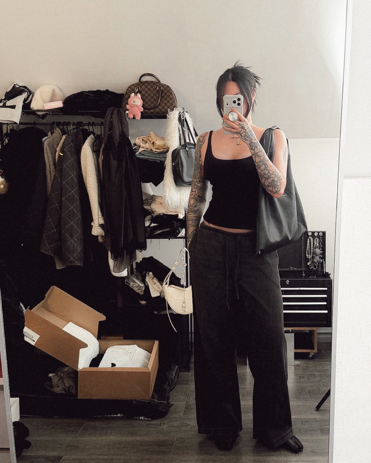 Dark grey and black blend, pull-on denim pants - affordable and super soft. Shocked by the smoothness. I was looking for something other than sweatpants for casual outfit wear. These are perfect. I’m 5’7, size medium. Perfectly oversized. They  had many pull up pants to choose from and out of the 3 I tried, these were my fave. Fits perfect for my height too. I saw how denim pants looked at my bro and decided I wanted a pair of my own 🤭 matched with Margiela tabis, margiela mm6 large black tote bag, and a simple, stretchy comfy black ribbed scoop tank top from H&M (medium) 

#LTKootd #LTKFindsUnder50 #LTKCyberWeek