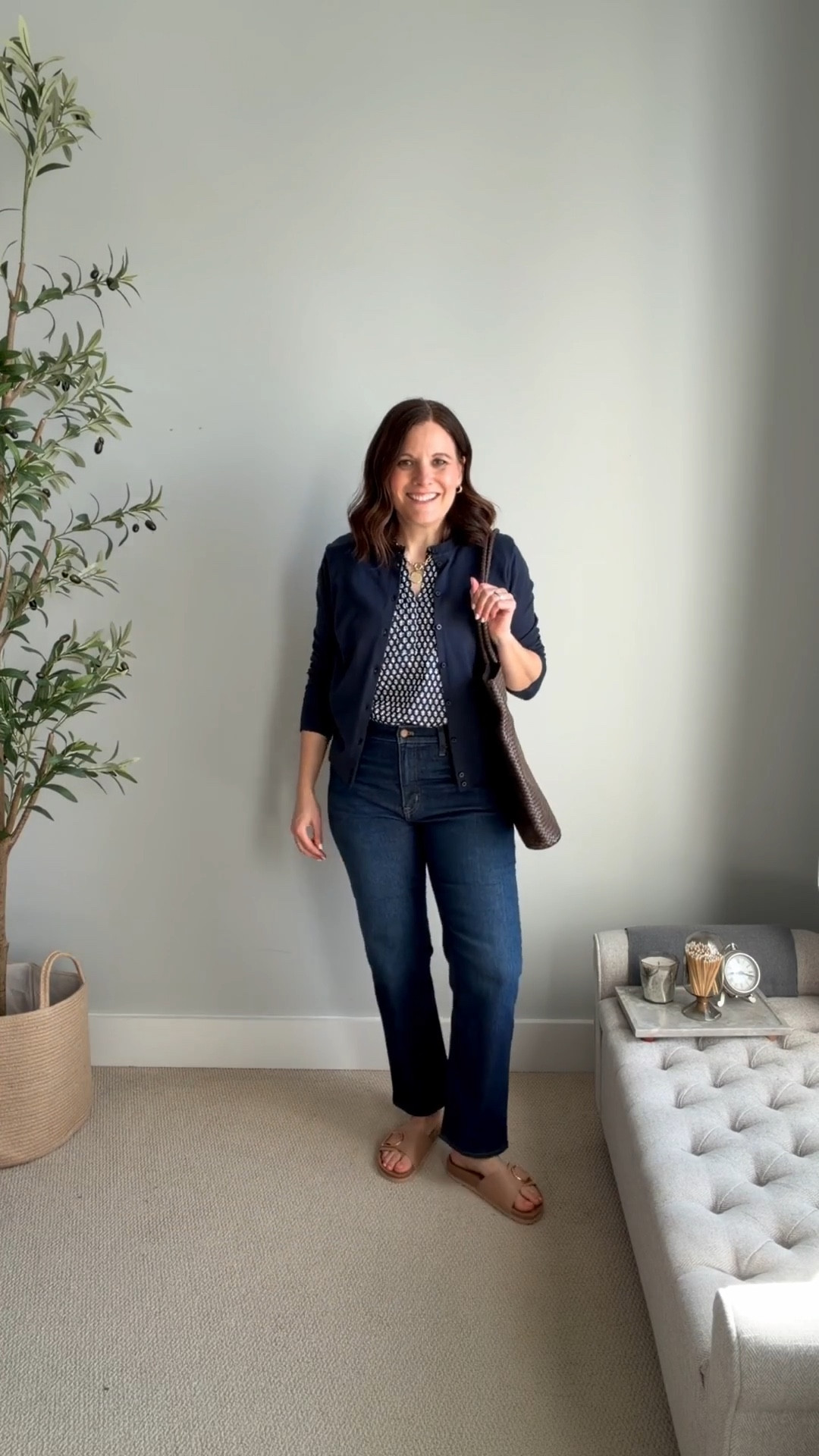 Spring jeans capsule wardrobe outfit fit notes: J.Crew Factory navy and white blouse fits TTS.  I’m in a Small. Wear it out or front-tucked. Cardigan fits small, sized up to large for easy layering. Midrise straight jeans (regular fit) true to size (tts), slides fit tts. 

#LTKMidsize #LTKSaleAlert #LTKOver40