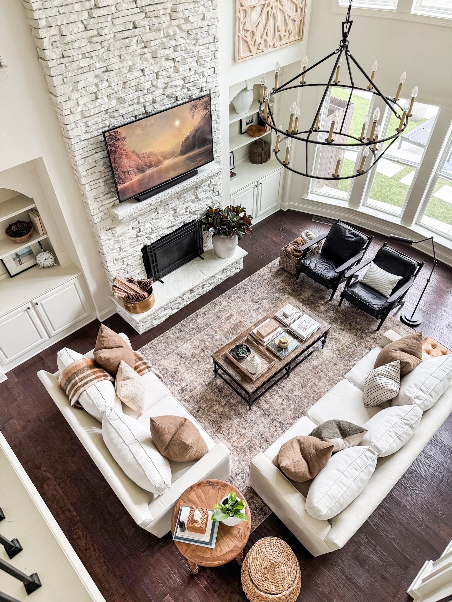 It feels so good to have Christmas put away and have a clean and fresh start to the new year with a change out to a warm neutral living room. home decor living room decor brown pillows plaid throw alabaster walls iron chandelier 

#LTKHome #LTKSeasonal
