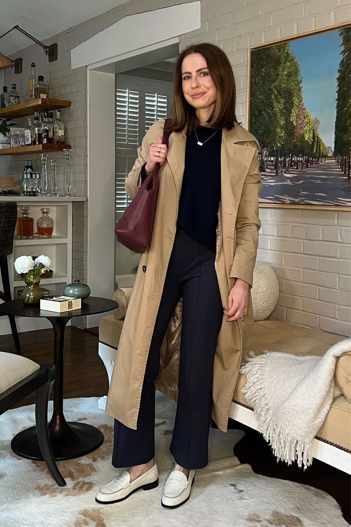 Transitional weather outfit:
STAUD navy kick flare pants
Sezane navy cardigan 
Trench coat
Koio white loafers
Maroon (burgundy) leather bag


#LTKstyletip #LTKworkwear #LTKSeasonal