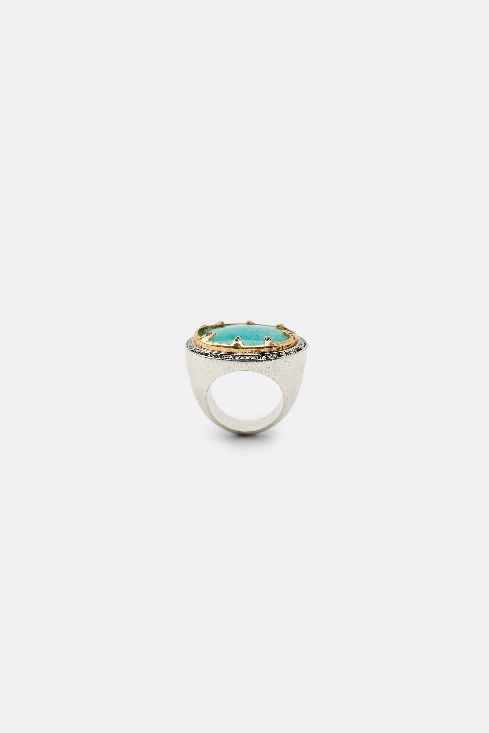 Model height: 183 cmOval metal ring featuring a coloured stone setting with contrast rhinestone a... | Zara UK