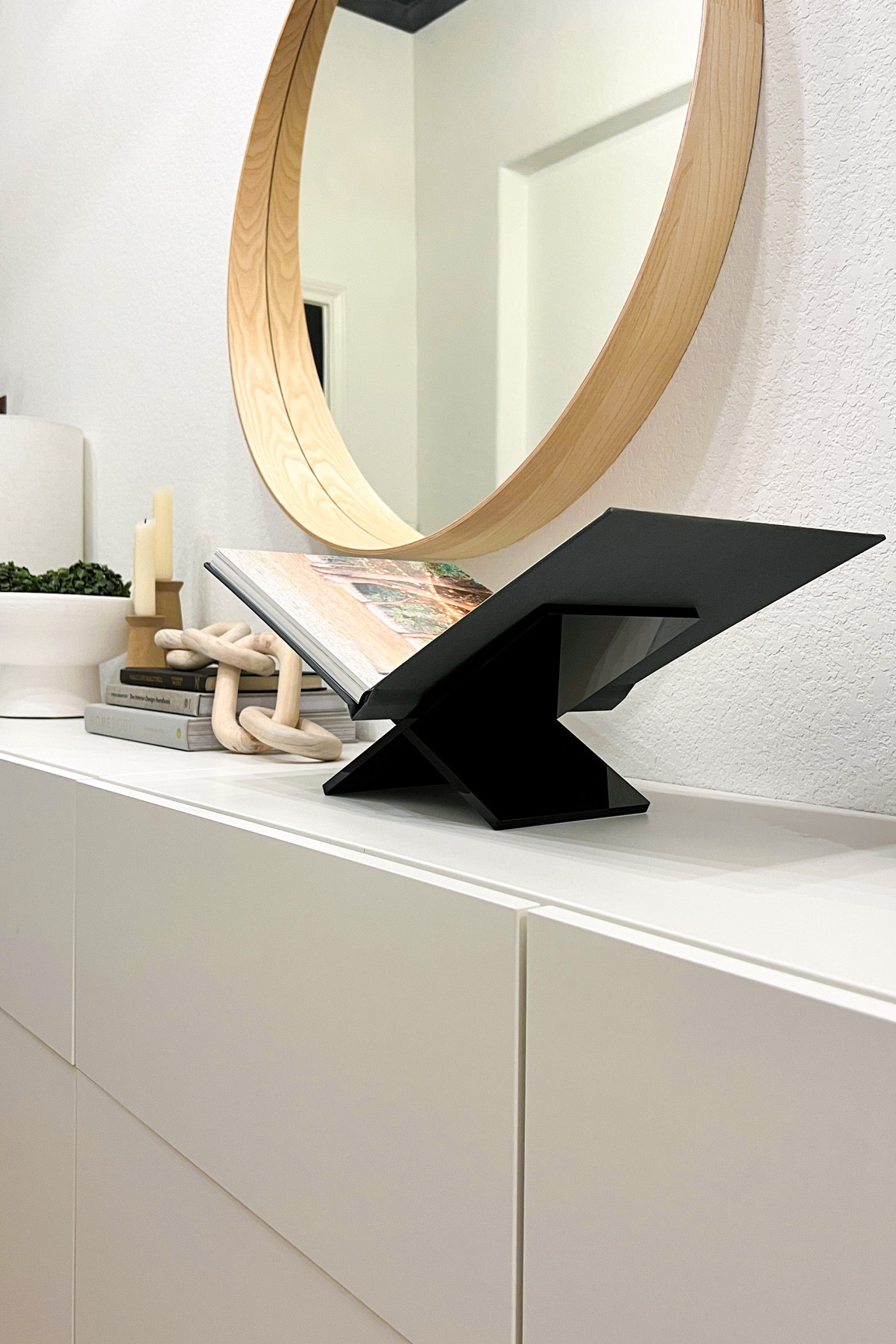 An acrylic book stand make the perfect table decor for your entryway or living room! Very elevated way to display your favorite coffee table book or photo album!

#LTKunder50 #LTKhome #LTKFind