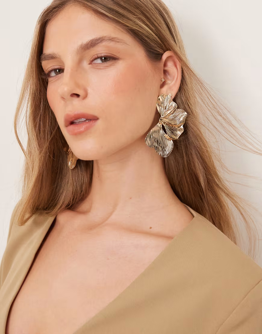 ASOS DESIGN stud earrings with oversized floral petal detail in gold tone | ASOS (Global)