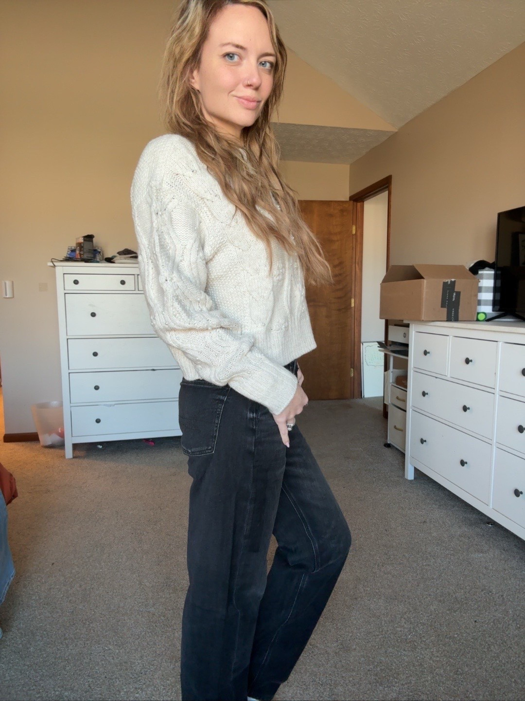 Neutral winter outfit from American Eagle that is so easy to style. Wearing an XS in this cable knit sweater and a size 0 in the cross over jeans. The crossover waistband gives such a flattering fit and the wide leg is super comfy for everyday wear. Perfect cozy outfit

#LTKmomlife #LTKCyberWeek #LTKootd