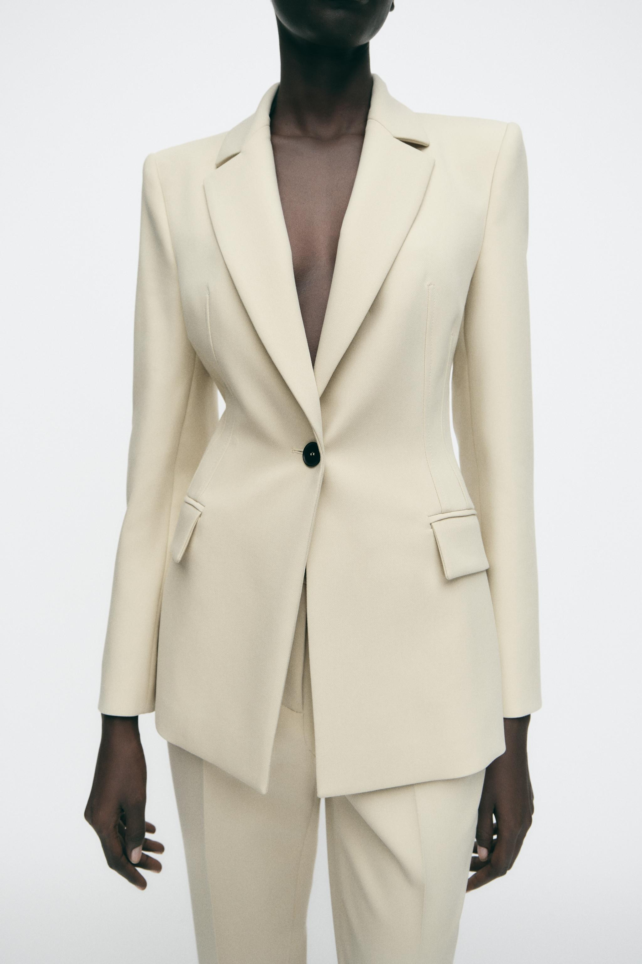 Blazer with lapel collar and long sleeves with shoulder pads. Front flap pockets. Single button f... | Zara US