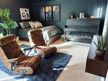 This teen wanted a “gamer vibe” but with a more grown-up feel. So we painted the room black, added in warm leather tones, mid-century modern pieces, and statement art - and we’re kinda obsessed it. 🙌🏻
#WoodlandsStyleHouse 

#LTKhome #LTKkids #LTKstyletip