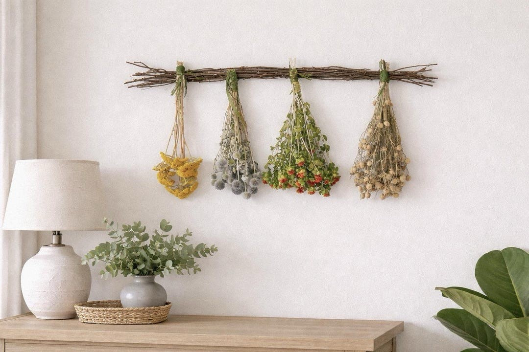 Bring the charm of a sunlit meadow indoors with this Prairie Floral Bundle Birch Hanger. A natural birch branch is styled with four delicate dried flower bundles—yarrow, safflower, echinops, and nigella—each adding texture, color, and organic beauty to your space. Perfect for kitchens, entryways, or cozy corners, this farmhouse-modern accent creates an effortless botanical display that feels both rustic and refined. #ltkhome #ltkstyle #driedflowers #farmhousestyle #prairiedecor #botanicaldecor #naturalhome #floraldesign

#LTKSeasonal #LTKHome