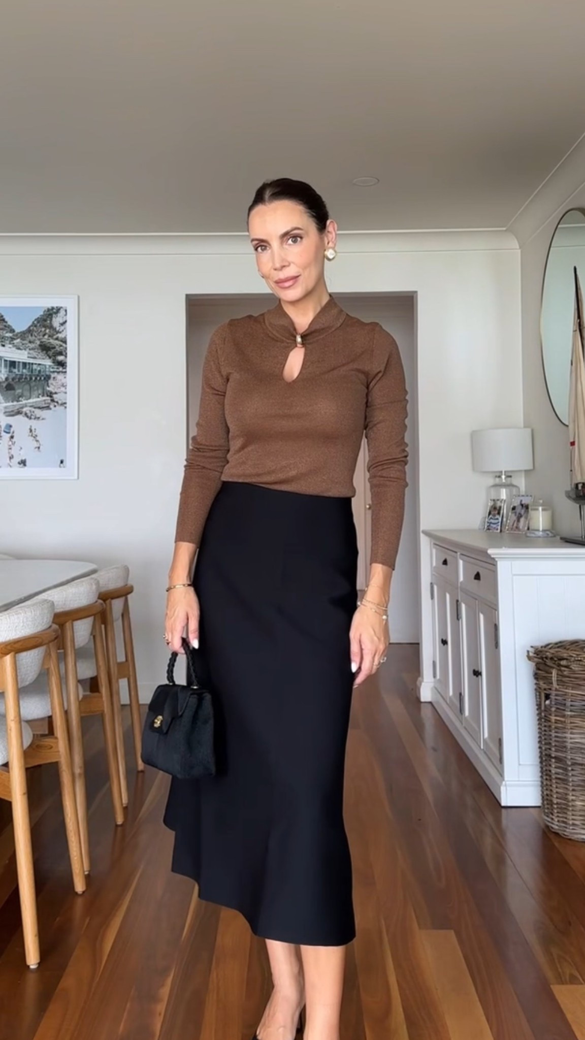 Autumn winter office outfit with a brown knit top and black midi skirt 

#LTKaustralia #LTKworkwear