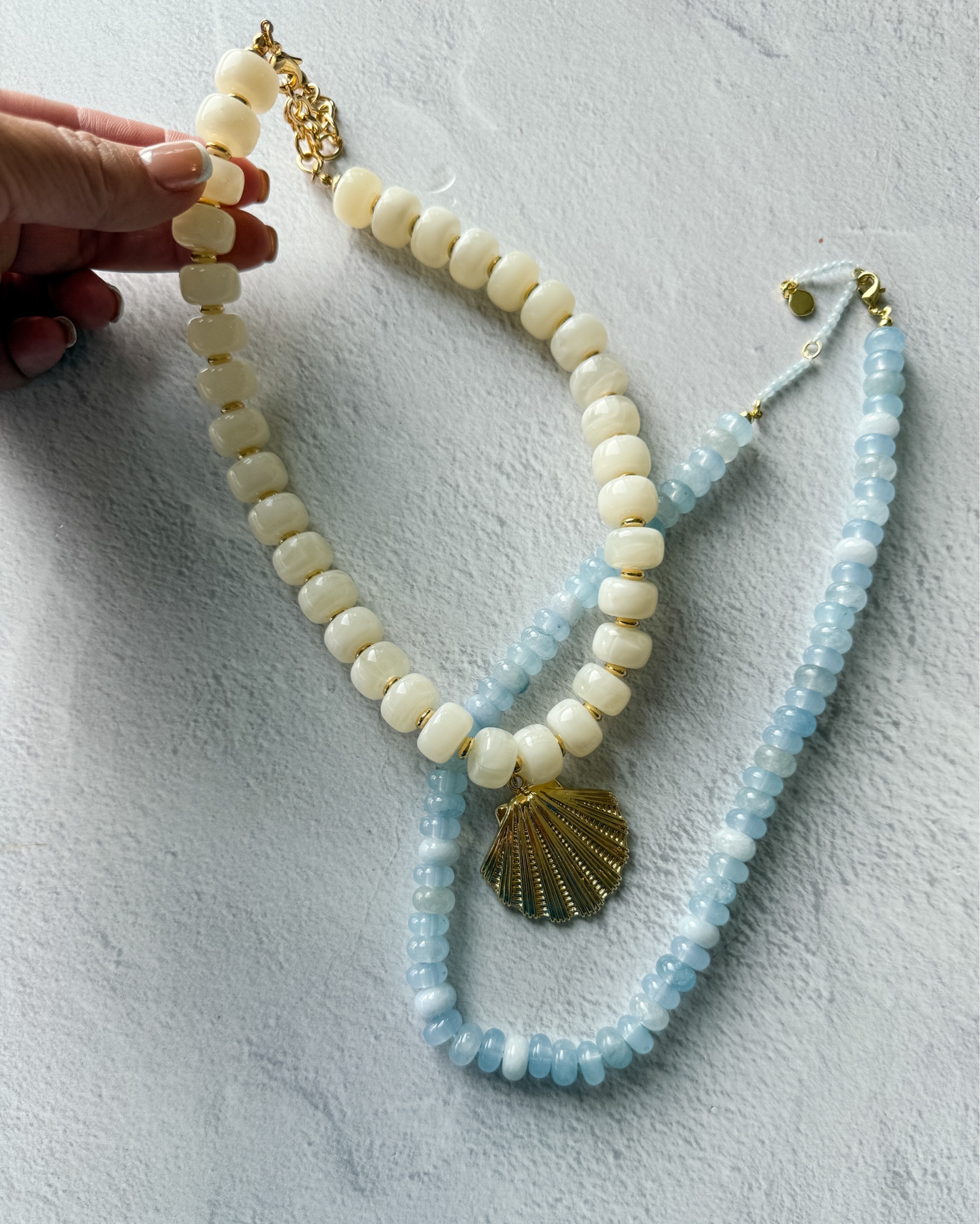 I have been hopping on the chunky beaded statement necklace trend and have found lots of affordable options like this cream version with a gold shell pendant for the vacay and this smaller light blue necklace from BaubleBar #summeraccessories #statementnecklace #trendingaccessories

#LTKgrwm #LTKootd #LTKSeasonal