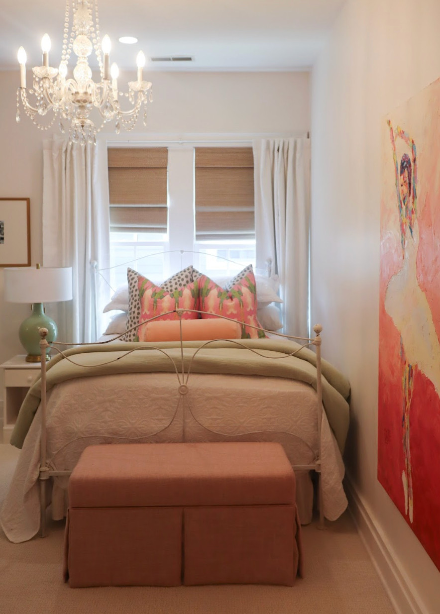 This pink and green bedroom makeover is proof that you can honor a room’s history while giving it a completely fresh feel.✨ We kept the original color palette but elevated it with softer, more sophisticated tones to create a cozy, welcoming space for the client’s new post-grad chapter. A creamy white backdrop and neutral beige flooring instantly brightened the room, while the vintage glass chandelier adds just the right touch of charm and sparkle. The result is a peaceful, grown-up guest room that beautifully blends nostalgia with new purpose — a timeless refresh that feels both classic and current.🌸💚 

 #bedroommakeover #classicstyle #timelessdesign #LTKHome #LTKFamily