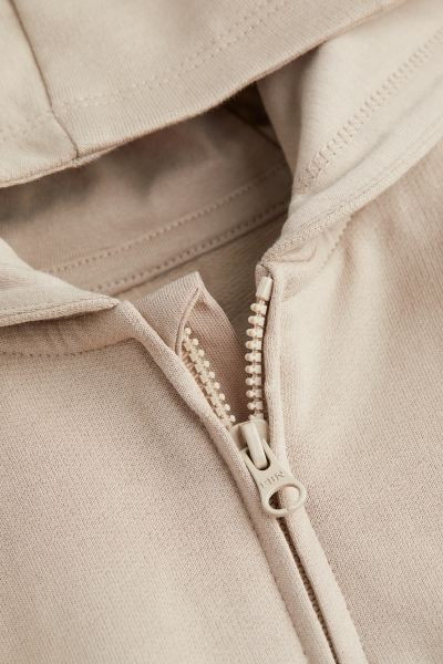 Set mit Kapuzenjacke und Hose aus weichem Bio-Baumwollsweat. Jacke mit jerseygefütterter Kapuze,... | H&M (DE, AT, CH, NL, FI)