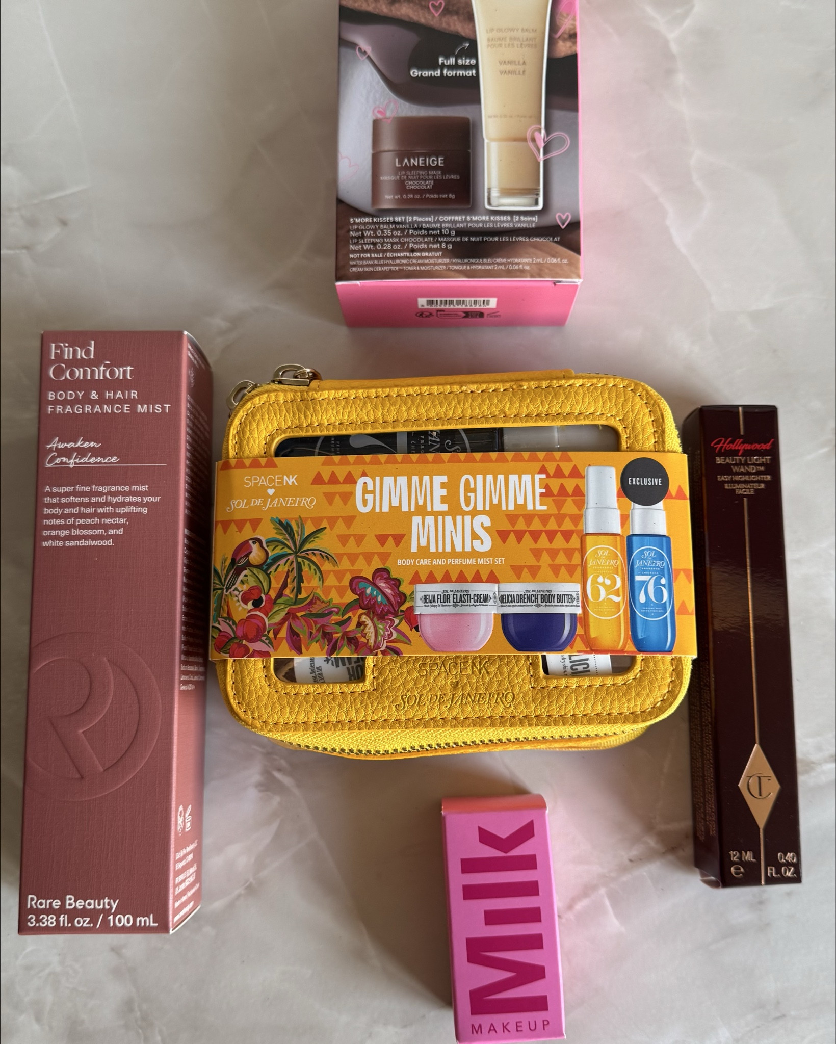 New make-up - LANEIGE lip mask, LANEIGE glowy lip balm, milk cheeck, Charlotte tilbury beautywand spotlight, rare beauty body & hair mist, Sol de januari body butter & perfume mist 