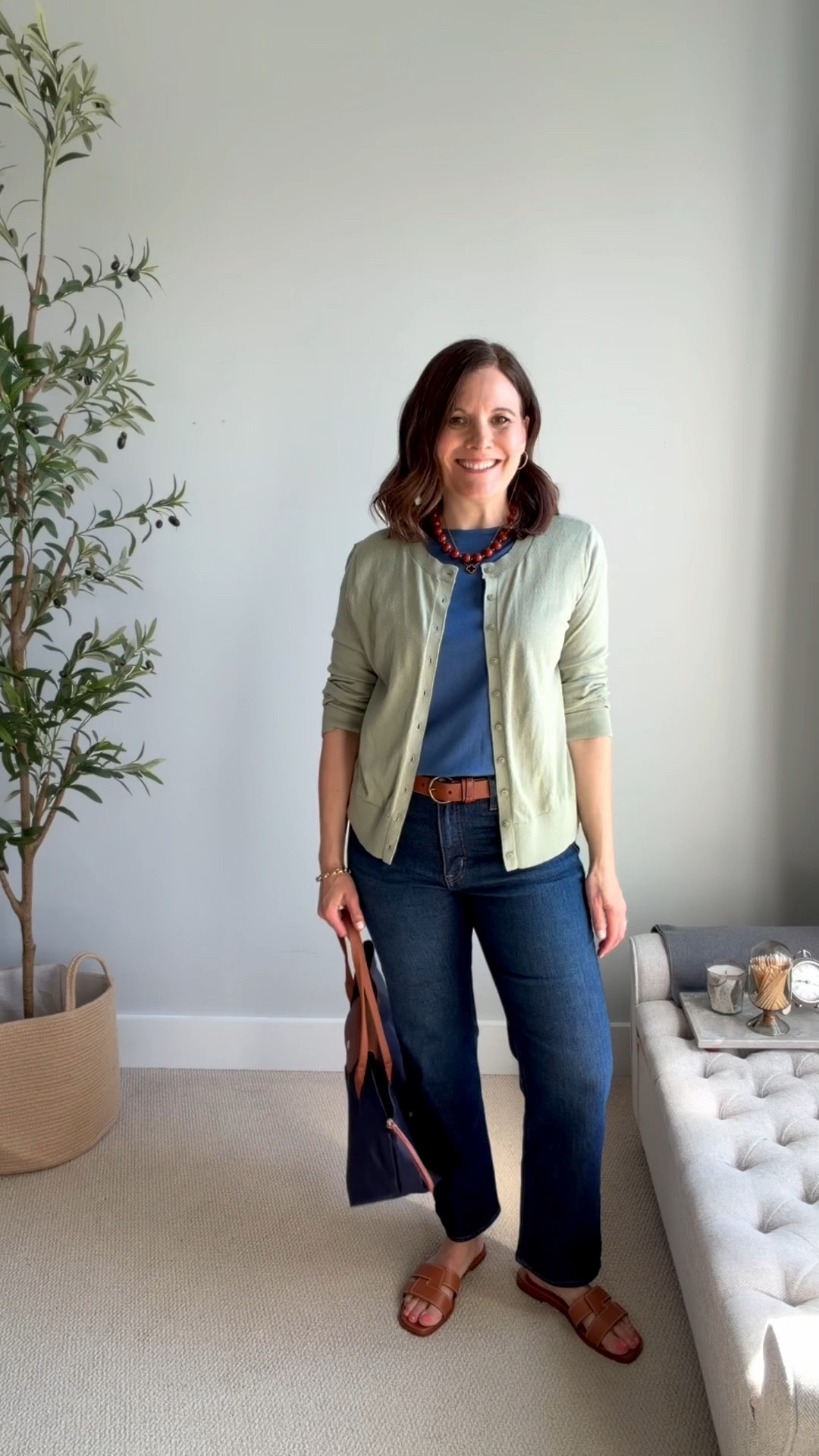 I’m pairing a blue tee and dark-wash midrise straight-leg jeans (true to size) with a sage-green cardigan (I sized up to a large but could also wear a medium). Dark wash jeans are such timeless jeans, and I love how they straighten the curves of my lower half. 

#LTKSaleAlert #LTKMidsize #LTKOver40
