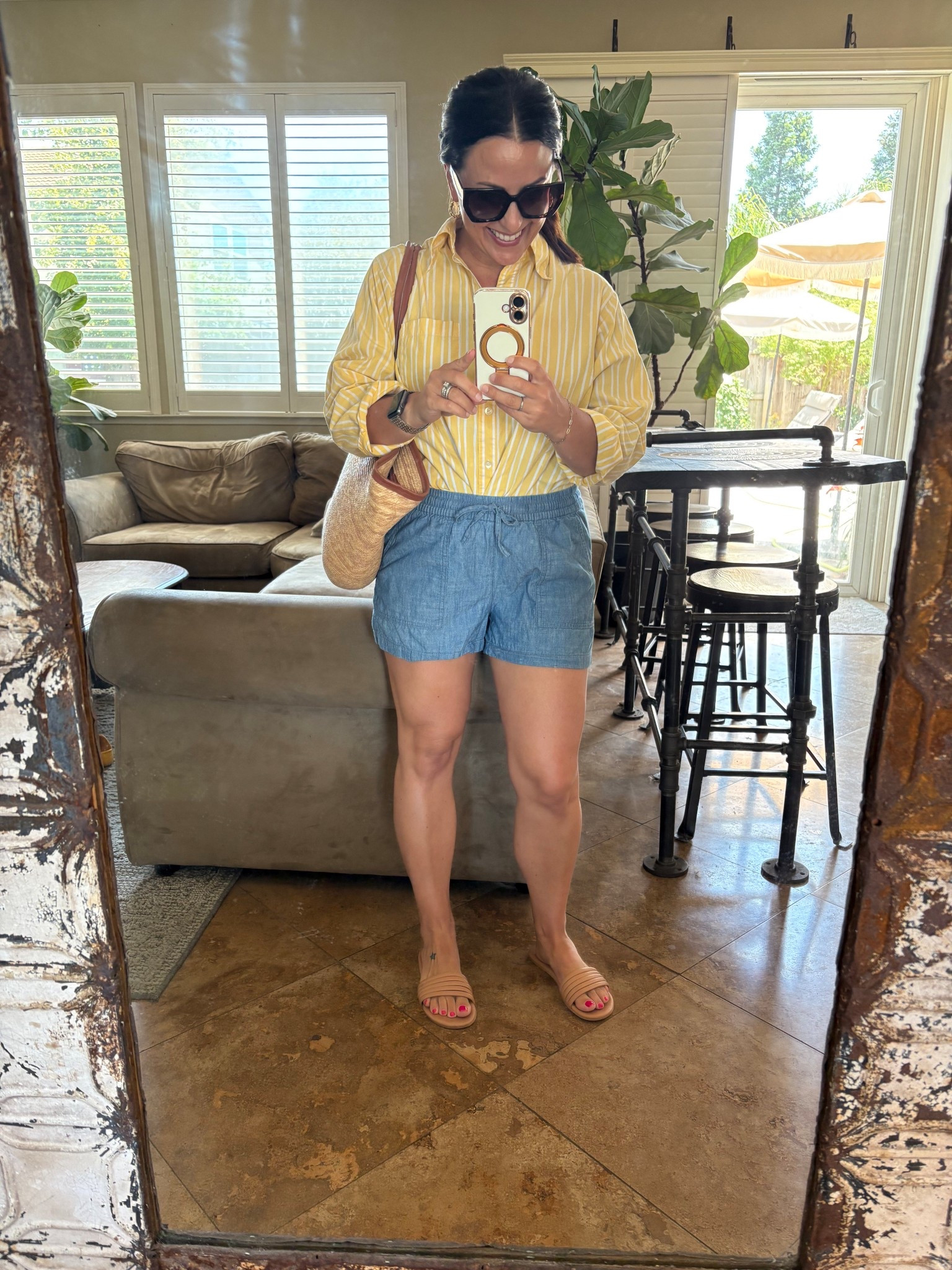 I’m in my classic, preppy summer era. Chambray shorts, size small, striped yellow button down shirt, sandals and straw tote. 

Mom style
Summer outfit
Vacation stylee

#LTKOver40 #LTKSummerEdit #LTKTravel