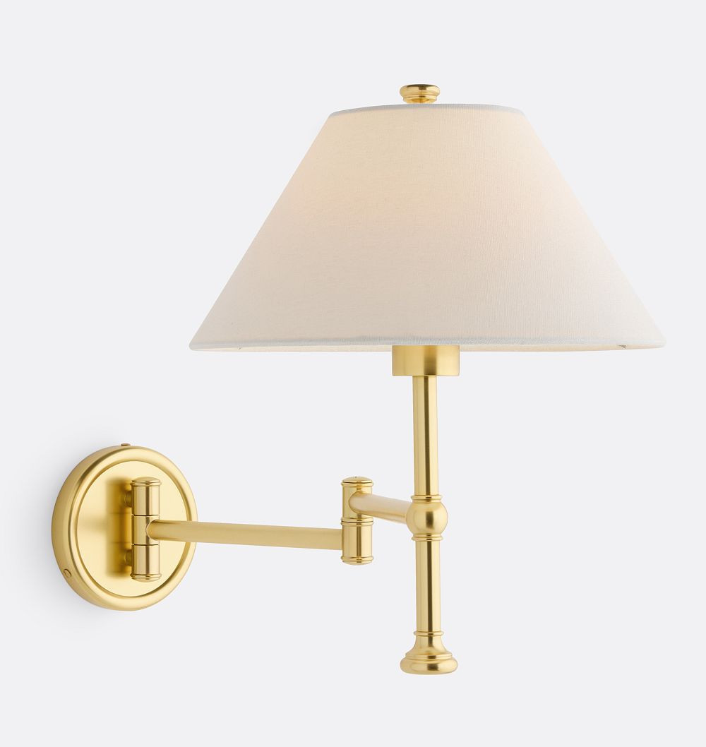 Rejuvenation Howell swing-arm sconce in aged brass with linen shade