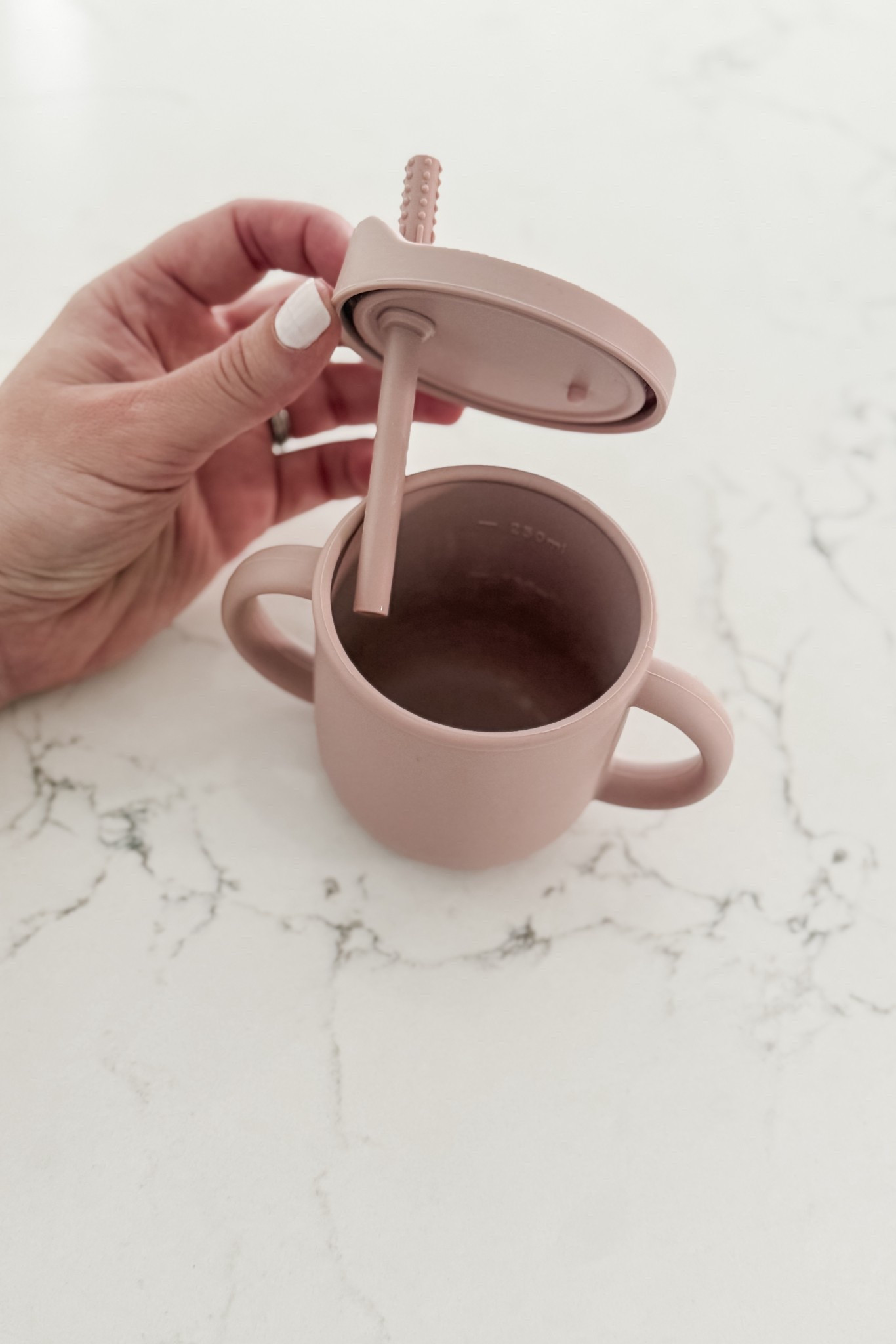 This is my favorite straw training cup for babies (and we’ve tried quite a few!). 
- The lid is easy for grown ups to remove / replace, but not for littles
- The straw stays put so no yanking out by tiny hands
- The double handles offer a great grip 
- I love the soft sides for gently squeezing to push liquid up for straw training
- Cup can also later be used as an open cup OR as a snack cup (with included lid)

#LTKBaby