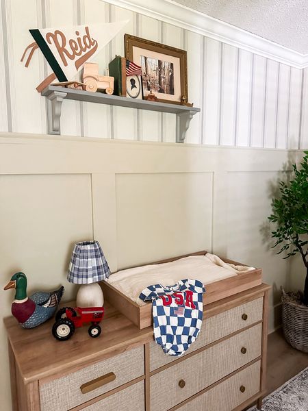 Cottage farmhouse nursery with pleated lamp and toys 

#LTKKids #LTKBaby #LTKHome