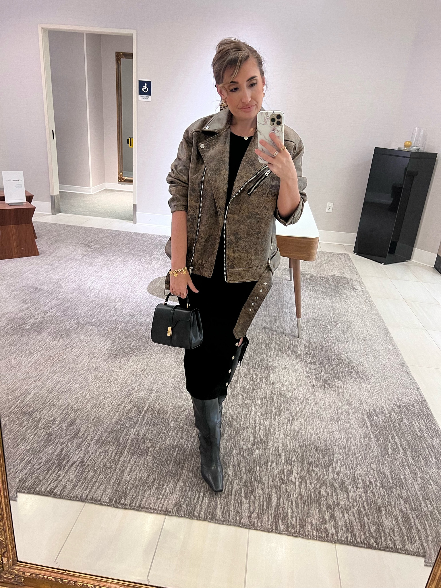 Moto jacket, black dress, mini 16, western boots 