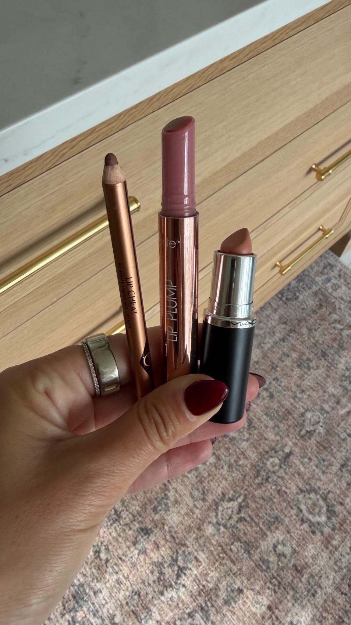 Latest fall lip combo. HOW TO: Heavily line lips. Dap just a small amount of lip stick on bottom middle and spread with finger. Tab same spot with gloss for a colored warn look (looks like lip stain). Stays all day! For more, add more :) 

Iconic nude liner
Cherry blossom gloss/ lip plumper
Flesh pot lipstick 


#LTKSeasonal #LTKFindsUnder50 #LTKBeauty