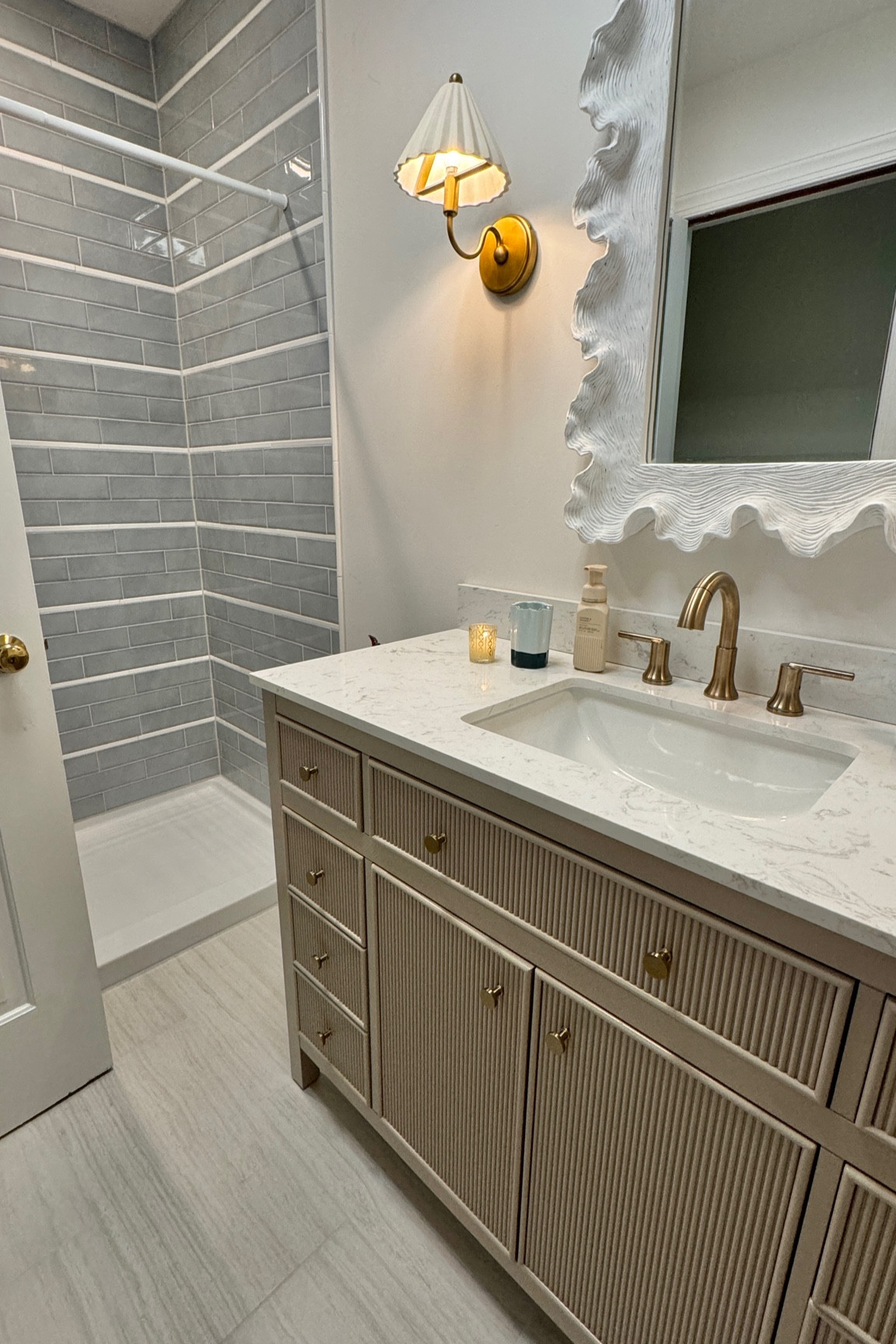 Our kids bathroom! Details on the tile work are on my blog classicallyjill.com 
Bathroom, mirror, faucet, vanity 

#LTKKids #LTKFamily #LTKHome