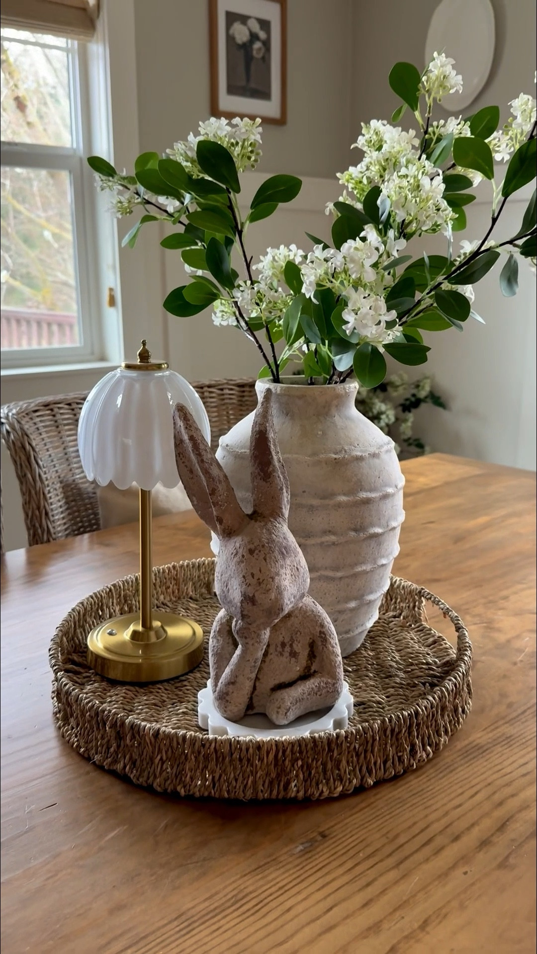 Simple, elegant and everything you've been asking about. 🌸 This little vignette basically styled itself — a bunny bust, a perfectly round woven tray, beautiful pottery, fresh stems and the star of the show… this rechargeable tulip lamp. 🌷 No cords, no outlet needed — just the most warm, dreamy glow that makes every corner it lives in feel like magic. It's one of those pieces that looks expensive, functions beautifully and goes with everything.
Together it all creates that collected, effortless spring moment that feels like it belongs in a European countryside home.
And yes — my outfit is linked too! 🌿
#EuropeanCottageDecor #SpringCenterpieceDecor #RechargeableLamp #CottageSpringStyle #SpringHomeDecor

#LTKHome #LTKSeasonal #LTKdayinmylife