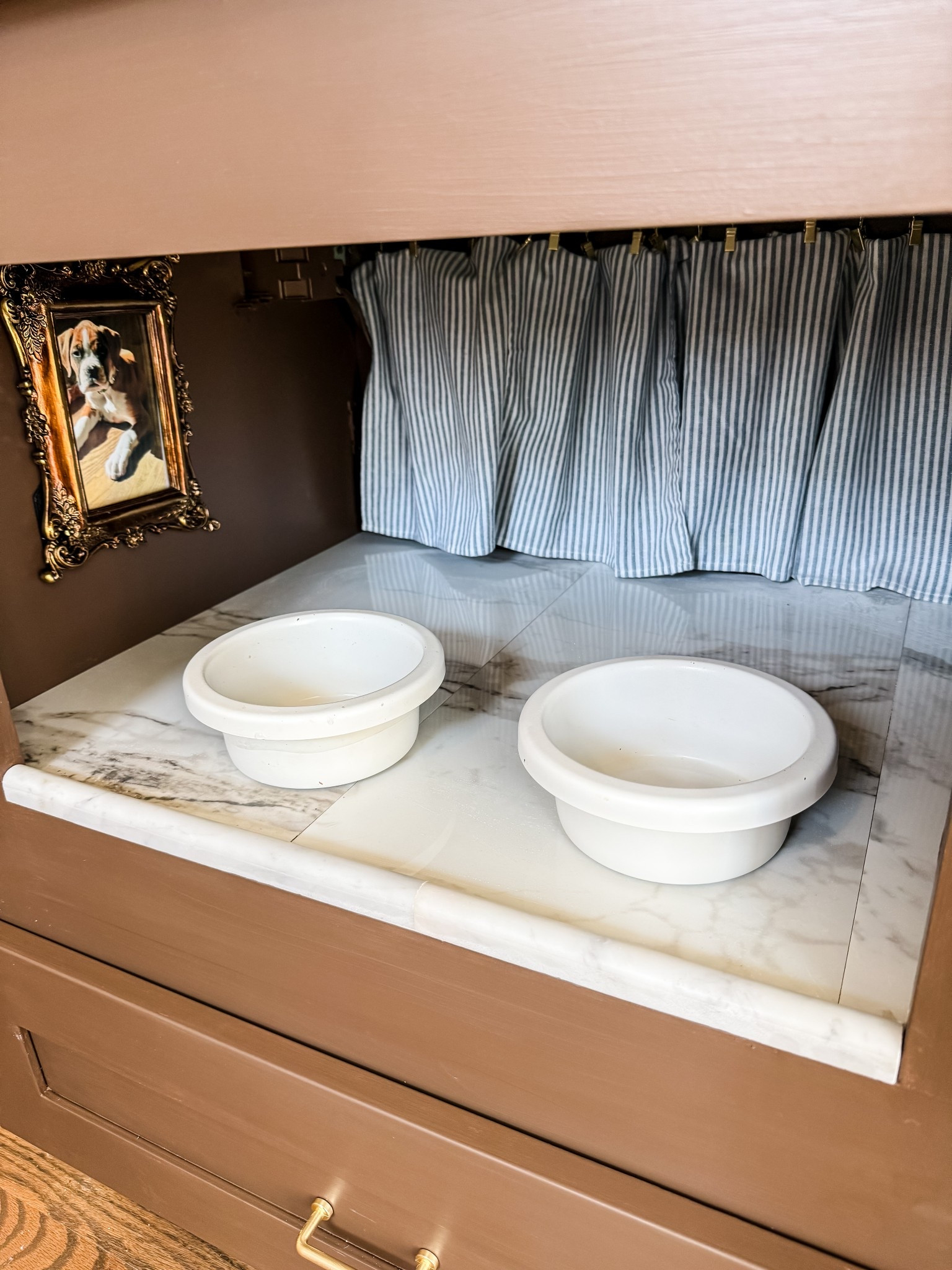 An island nook turned dog bowl station thanks to some really inexpensive pieces! 

#LTKHome